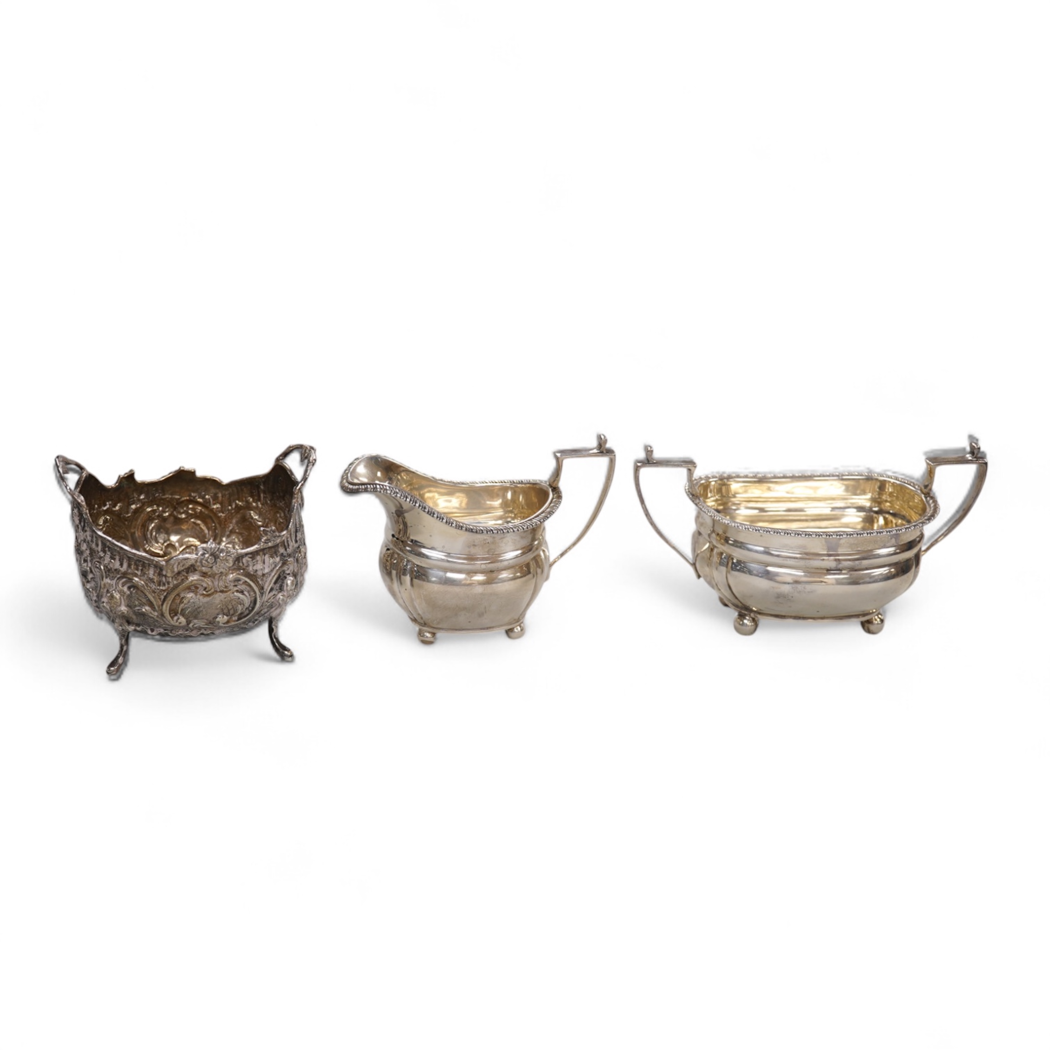 A George V silver two handled sugar bowl and matching cream jug, Z Barraclough & Sons, London, 1918, together with a late 19th century German Hanau silver sugar bowl, 10.5oz.